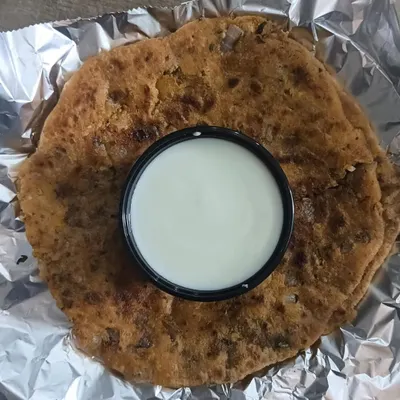 My special Mix Paratha, stuffed with a savory filling and served with a side of cool curd. It's a wholesome and filling meal in itself.