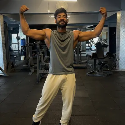 My biceps are my secret weapons. A classic double bicep pose to show the results of consistent arm training.