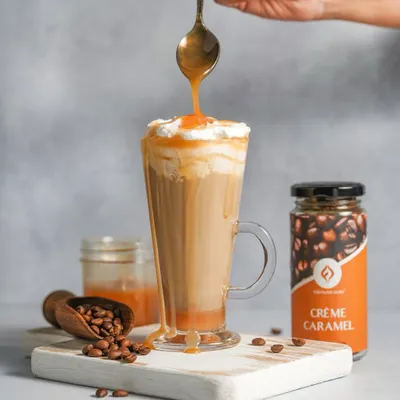A decadent caramel drizzle being poured over a Crème Caramel iced coffee. Action shots like this are my specialty, creating a dynamic and mouth-watering image that captures the essence of the drink.