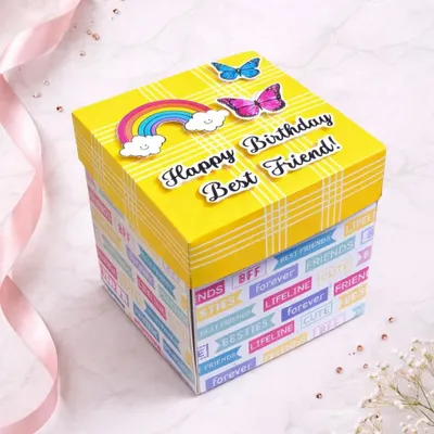 This bright yellow box is perfect for a best friend's birthday. The lid is decorated with rainbows and butterflies, hinting at the colorful surprise waiting inside.
