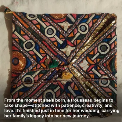 This is a classic 'Kalechi' pouch, a traditional design from our community featuring dense and vibrant Pakka embroidery. It is stitched to be strong and lasting, a perfect example of a functional heirloom.