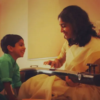 "Music and Children are my life." A candid moment of me, Madhumita, sharing a smile with a young student. These moments of connection are what I cherish the most.