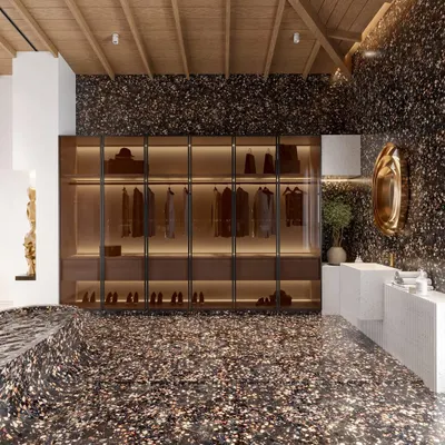 I designed this bathroom to be a statement of modern glamour. The space is defined by a bold terrazzo finish that flows from the floor up into a sculptural, sunken tub. This, combined with a warm vaulted wood ceiling, creates a dramatic yet inviting spa-like sanctuary.