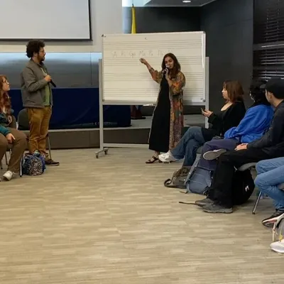 A typical workshop scene where I'm explaining the structure of a raga using a whiteboard. I find that visualizing the notes helps students grasp the melodic framework of Carnatic music more intuitively.