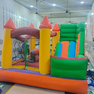 A look inside my workshop where a classic bouncy castle is being inflated for a quality check. This one has a slide and a jumping area.