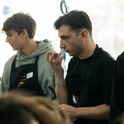 A student from UNISG, Italy, carefully tasting and analyzing flavors during a specially curated workshop at Lavonne.
