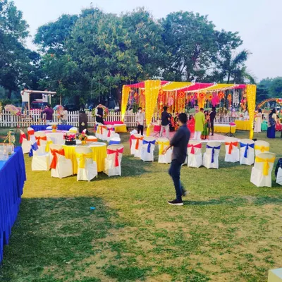 A vibrant outdoor mehandi setup we catered for, with colorful decor and socially distanced seating. We can adapt our service style to any venue and theme.