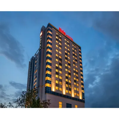 The exterior of the IBIS Hotel in Vikhroli, an IGBC Gold rated building. The facade demonstrates a clean, modern aesthetic suitable for a contemporary business hotel in a bustling Mumbai suburb.