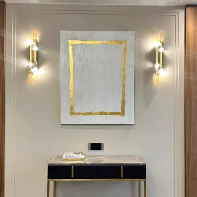 This textured painting with a simple gold leaf border was installed in a beautiful Hyderabad home. The gold frame is part of the artwork itself, adding a touch of glamour to the minimalist, textured piece.