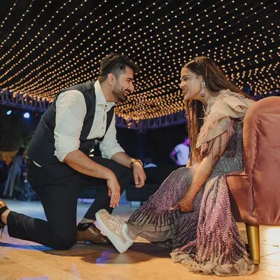 A sweet, romantic moment between the couple under a canopy of fairy lights during their Sangeet. I create intimate spaces for you to connect amidst the celebration.