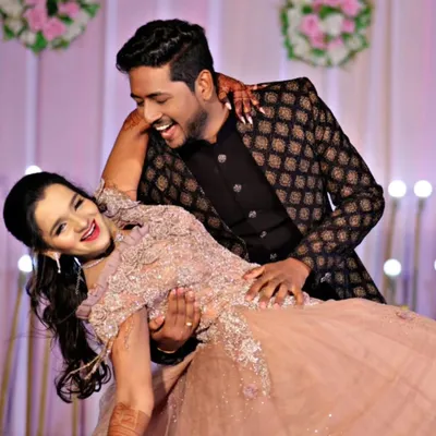 Couple look without the long-term commitment. This happy couple is dancing the night away in our coordinated gown and Jodhpuri suit.