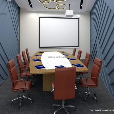 This conference room is designed for focus and collaboration. The angled wall panels provide acoustic benefits and visual interest, while the large projection screen and comfortable seating make it ideal for presentations.