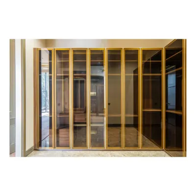 A walk-in closet is a personal luxury. I designed this one with fluted glass and brass-finished frames, allowing the clothes to be subtly visible while maintaining an elegant, clean look. The marble flooring adds to the sophisticated feel.