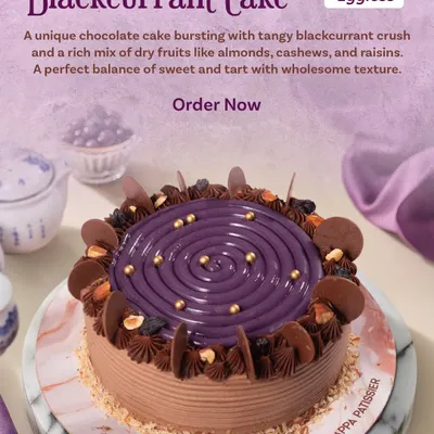 Sweet meets tangy in our Blackcurrant Cake. This eggless chocolate cake is bursting with a tangy blackcurrant crush and a rich mix of dry fruits like almonds, cashews, and raisins.
