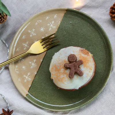 A festive plate from my Christmas collection, featuring a two-tone glaze and a delicate snowflake pattern. Perfect for serving holiday treats.