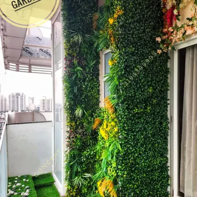 A complete balcony makeover featuring a combination of different textures. We used high-density artificial turf for the flooring and two styles of vertical gardens to create a dynamic and visually interesting space.