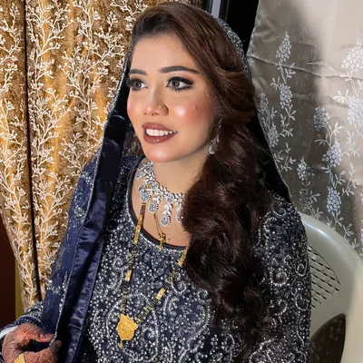 This bride's royal blue outfit was absolutely breathtaking. I created a smokey eye and a soft nude lip to complement the richness of the color. She looked so elegant and unique.