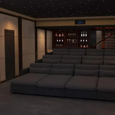 For larger spaces or a more relaxed setting, we design custom multi-level lounge seating. This configuration provides comfortable viewing for many guests and can include features like integrated bars and cabinetry.