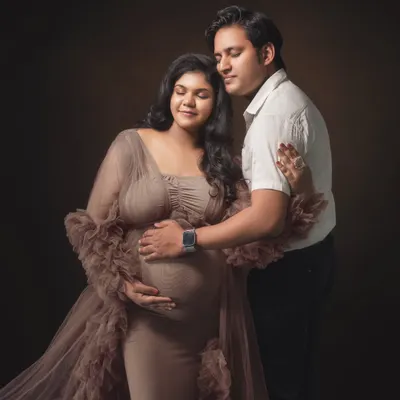 With eyes closed and hearts open, they share a quiet moment of anticipation. I used soft, painterly lighting to wrap them in warmth, emphasizing the serene and powerful connection between them in this classic maternity portrait.