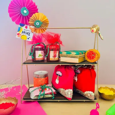 Celebrate the colors of joy with my Holi hampers! This two-tiered stand is curated with jars of thandai mix, organic gulal, and other festive treats, making it a perfect gift for family and friends.
