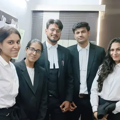 With my talented team of associates at Empyreal Law Offices. We work together to build strong defense strategies for our clients.