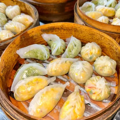 My live dim sum station is a journey into Asian cuisine. I offer a variety of handcrafted dumplings, including corn and water chestnut, edamame truffle, and mixed vegetable, all steamed to perfection in traditional bamboo baskets.