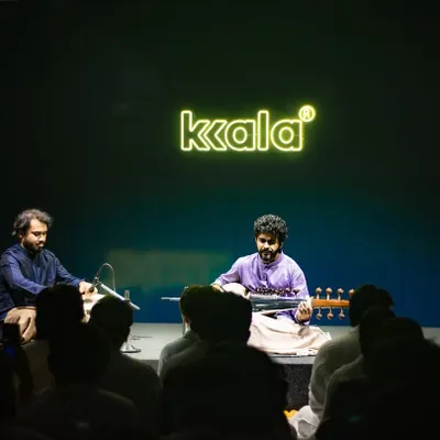 Performing at a 'Kala' concert, providing tabla accompaniment for a talented sarod artist. The dark, intimate setting allowed for a deeply focused musical dialogue.