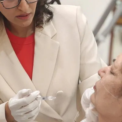 A close-up view of a dermal filler injection during a training session. My focus is always on the precise placement of the product to ensure a natural and balanced result, whether I am treating a patient or teaching fellow doctors.
