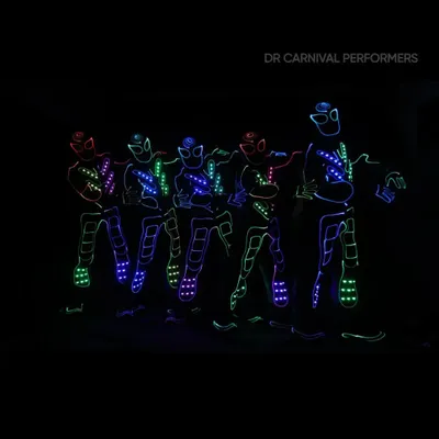 A team of our Tron dancers posing in their multi-colored LED suits. This is the future of dance, ready to light up your event.