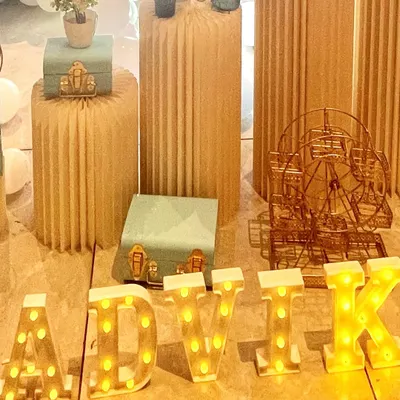 We offer personalized light-up marquee letters, like this 'ADVIK' sign, to add a special and bright touch to any celebration.