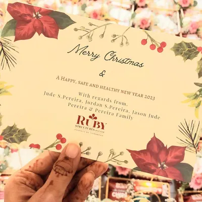 Spreading holiday cheer with our custom Christmas hampers. This image shows the personalized greeting card we designed for a client's bulk holiday order.