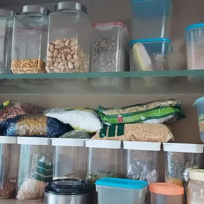 This is a common sight in many kitchens, a pantry filled with open packets and clutter. This is the 'before' state, the chaos that we transform into a functional, streamlined system.