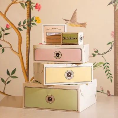 My range of pastel-colored, French-inspired packaging, stacked beautifully. Each box is designed to make the unboxing experience as delightful as the treat inside.