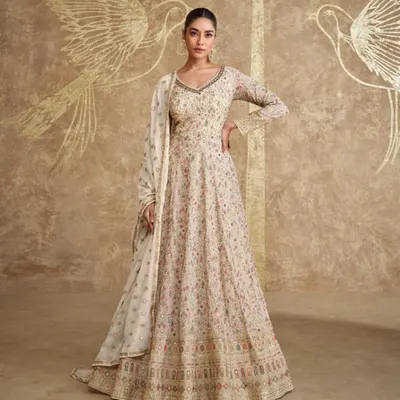This floor-length Anarkali is the epitome of understated luxury. The full-flair design is covered in delicate, multi-colored floral embroidery, making it a work of art.