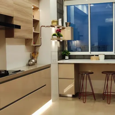 A closer look at the breakfast bar setup. It’s a perfect spot for a morning cup of tea or for kids to do their homework, making the kitchen a multi-functional family space.