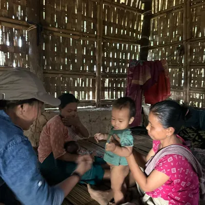One world: as a scientist, I work on the ground, connecting with communities in rural Tripura. This is me during a fieldwork session, a world away from the DJ booth.