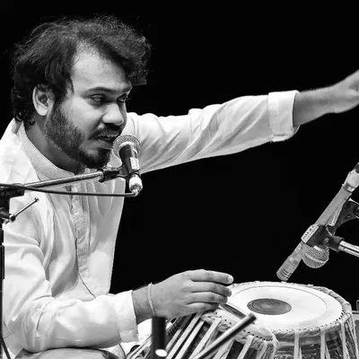 A moment of deep concentration during a live performance. When I play, I try to communicate the story of the composition through every beat.