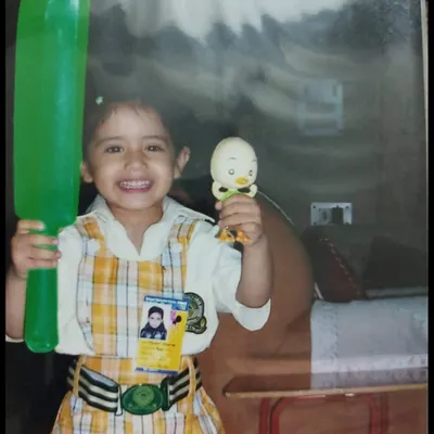This is me, little Nonu. I started just by humming songs to myself, and I never imagined that one day so many people would connect with my music. This picture reminds me to stay true to that little girl.