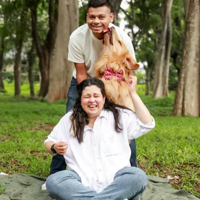 This is the kind of happy chaos I live for! A goofy, spontaneous lick from a fluffy Golden Retriever makes for the most memorable and authentic family photo.