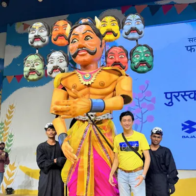 Standing proudly with the 12-foot-tall Ravan puppet we designed for Aamir Khan's Paani Foundation. Each of its ten heads represented a different challenge faced by farmers.