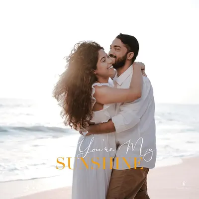 A sun-kissed embrace on the beach, a perfect "you're my sunshine" moment. Pre-wedding shoots like this are a wonderful way to capture your love story in a beautiful, natural setting.
