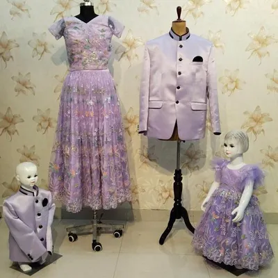 A complete family combo in lavender. I designed a floral gown for the mom, a matching frock for the daughter, and coordinated Jodhpuri suits for the father and son.