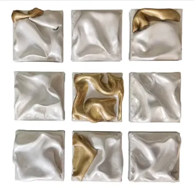 This is "THE DANCING SQUAD," a set of nine panels that create an abstract ballet of texture and color. The gold pieces are the lead performers, breaking the silver rhythm with energetic bursts, telling a story of harmony and contrast.