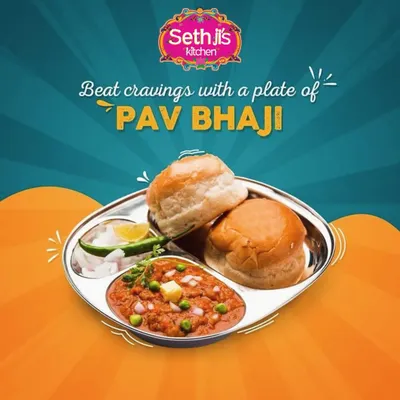 Our delicious Pav Bhaji, plated and ready to eat. The rich, buttery bhaji is served with soft pav buns, chopped onions, and a slice of lime.