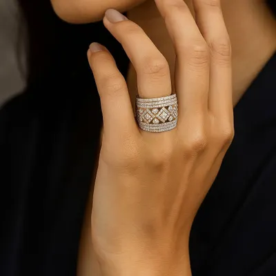 Some rings are accessories, this one is a statement. Worn on the hand, this wide, intricately patterned diamond ring is a reflection of power, grace, and individuality.