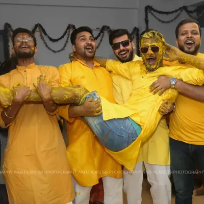 The Haldi ceremony is all about unrestrained fun, and we love capturing that energy. This shot of the groom and his friends perfectly encapsulates the joy and camaraderie of pre-wedding functions.