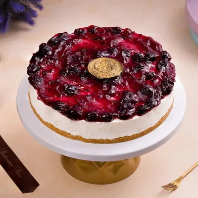 A beautiful blueberry cheesecake, perfectly styled and lit for an online delivery menu. We ensure every detail, from the glossy topping to the crumbly base, looks enticing to customers.