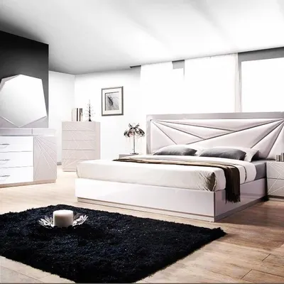 This complete bedroom set features a clean, white finish with geometric detailing on the headboard and matching furniture. I design bedroom collections to create a peaceful, serene, and cohesive retreat.