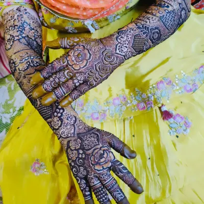 A beautiful bridal design with a rich, dark stain, posed against a vibrant yellow outfit.