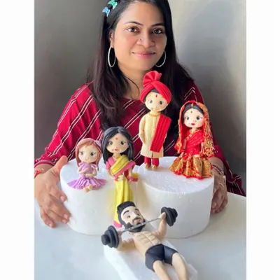A showcase of my handcrafted fondant figurines. Each one, from the fitness enthusiast to the traditional Indian couple, is sculpted with love and passion to bring your sweet moments to life.